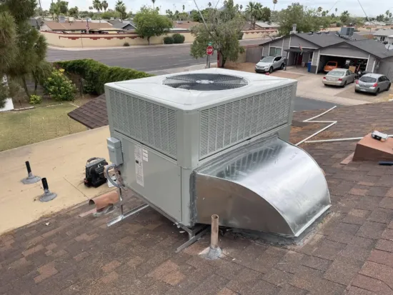 a photo of a rooftop AC unit replacement