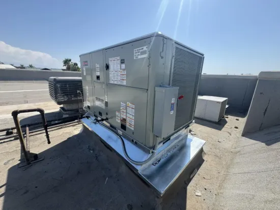 A photo of a commercial rooftop AC unit inspection